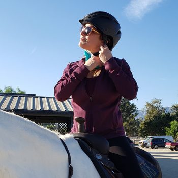 Dr. Vivian Roknian riding a horse