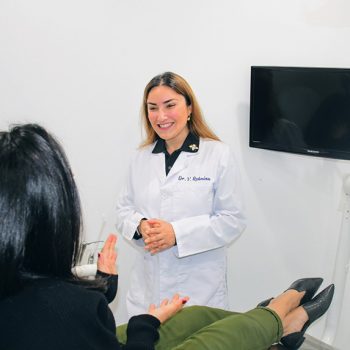 Dr. Vivian Roknian smiling with patient