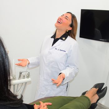 Dr. Vivian Roknian smiling with patient